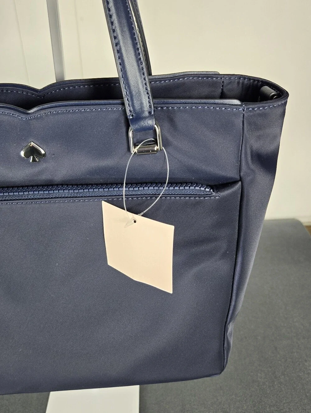 kate spade navy structured tote with front zip pocket